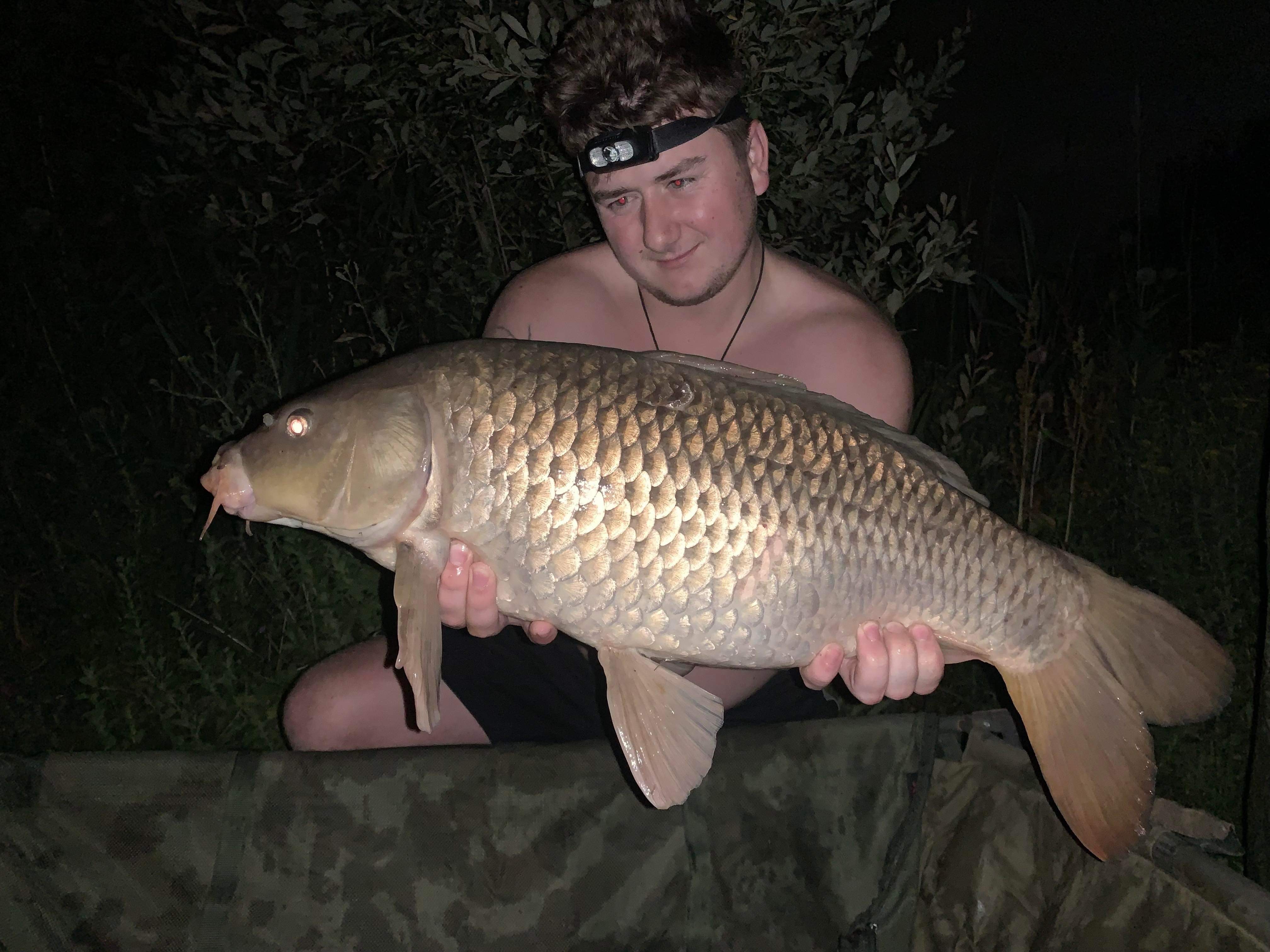 Angler with a carp caught at Alderwood Fishery
