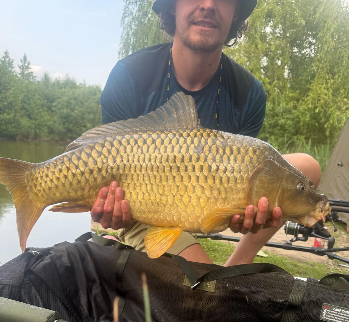 Angler with a carp caught at Alderwood Fishery