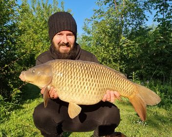 Angler with a 16lb 12oz carp caught at Alderwood Fishery