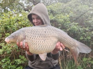 Angler with a carp caught at Alderwood Fishery