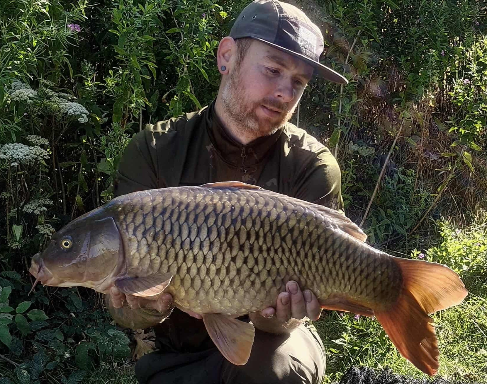 Corey with a carp caught at Alderwood Fishery